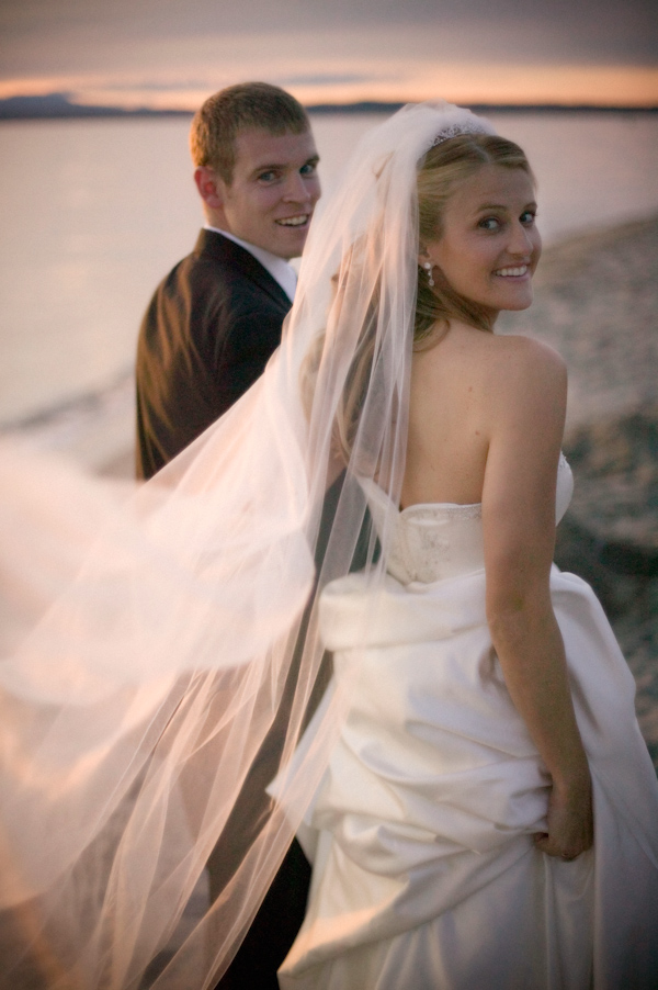Adorabble bride and groom on a beach - wedding photo by J Garner Photographer